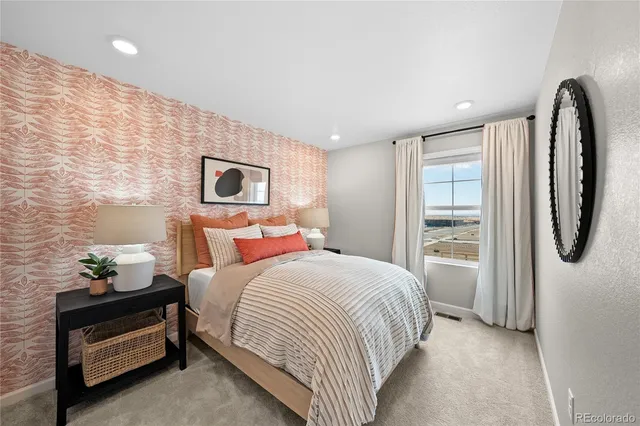 a view of a dining room with furniture and a potted plant