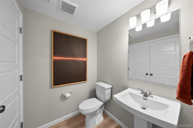 a spacious bathroom with a shower sink and mirror