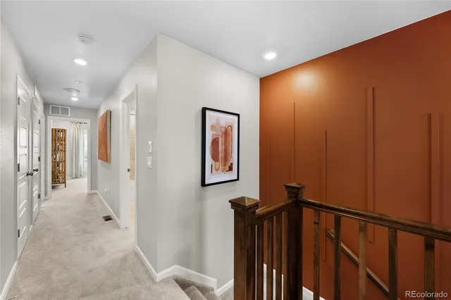 a view of a dining room with furniture a kitchen and wooden floor