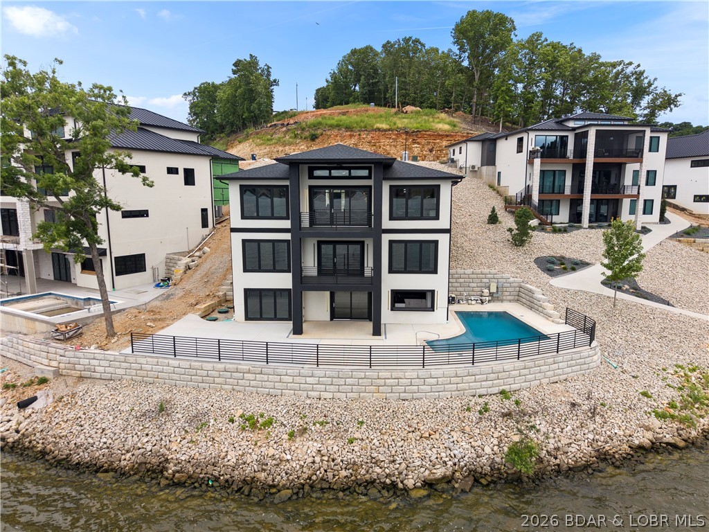 439 Red Bud Road Lake Ozark, MO 65049 - Photo 76 of 98 Rear exterior showcasing the home's striking moder
