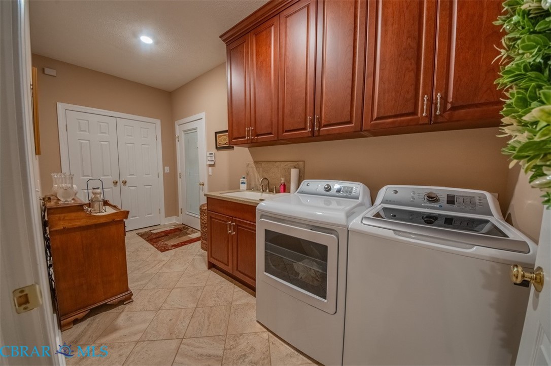 120 North Shore Road Locust Hill, VA 23092 - Photo 35 of 39 Laundry room featuring washing machine and dryer and cabinet space