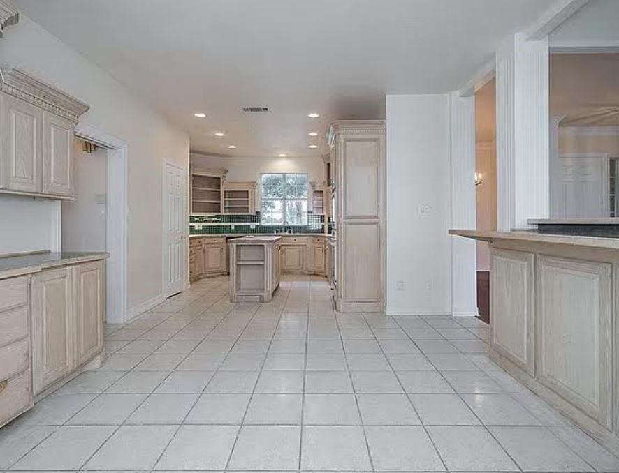 1191 Pasewark Circle Prosper, TX 75078 - Photo 12 of 20 a kitchen with stainless steel appliances granite countertop a refrigerator and a sink