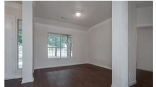 1191 Pasewark Circle Prosper, TX 75078 - Photo 2 of 20 a view of an empty room with wooden floor and a window
