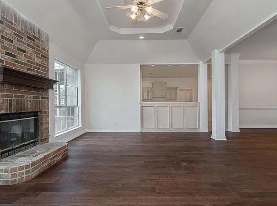 1191 Pasewark Circle Prosper, TX 75078 - Photo 6 of 20 a view of a livingroom with wooden floor and a kitchen