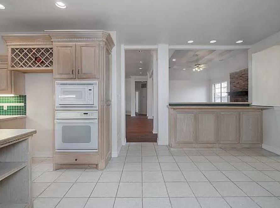 1191 Pasewark Circle Prosper, TX 75078 - Photo 9 of 20 a view of kitchen with cabinets and refrigerator