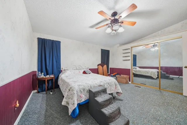 a bed room with a bed and window