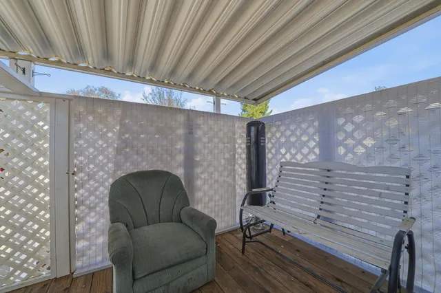 a view of a hallway with closet and bathroom