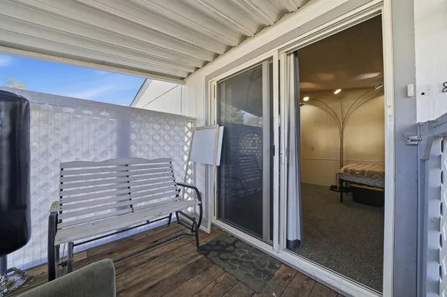 a view of walk in closet with clothes