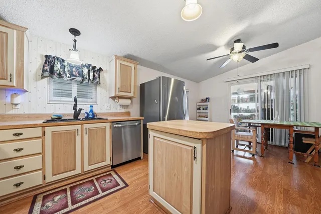 a kitchen that has a lot of cabinets in it