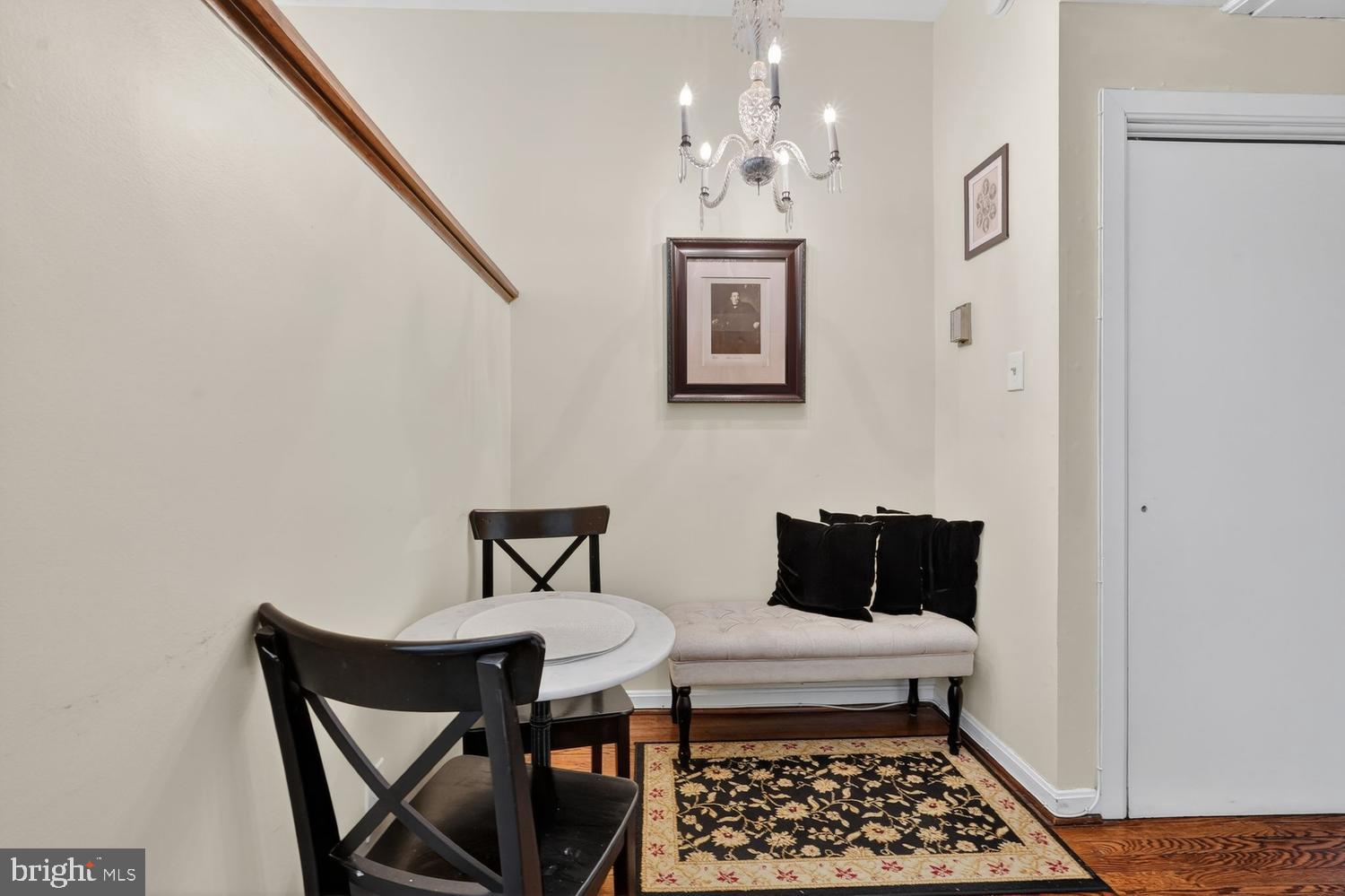 11 2nd Street Northeast, Unit 208 Washington, DC 20002 - Photo 4 of 12 a bedroom with a bed and wooden floor
