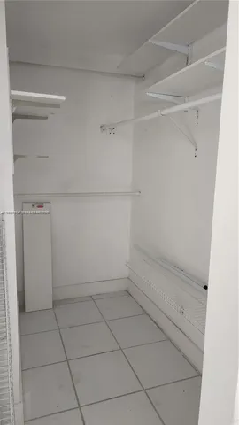 a view of storage and utility room with empty racks