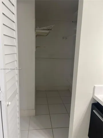 a view of cabinets and wooden floor