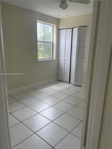 a kitchen with granite countertop stainless steel appliances and wooden cabinets
