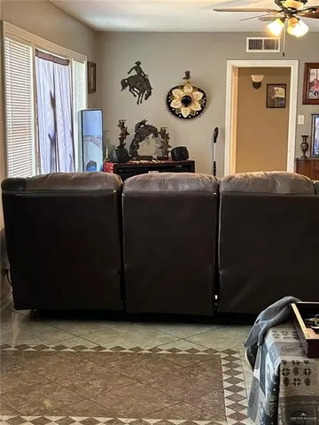 a living room with furniture and a rug