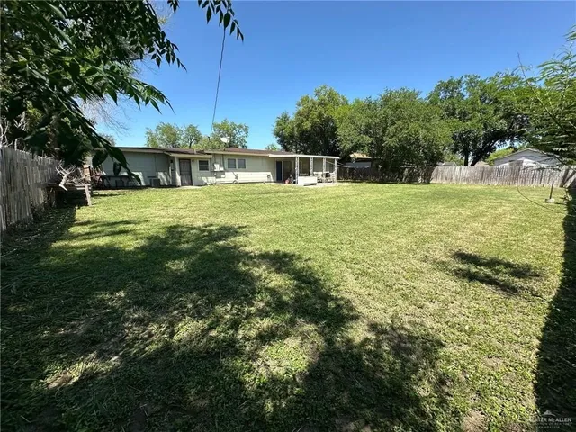a kitchen with a sink appliances and cabinets