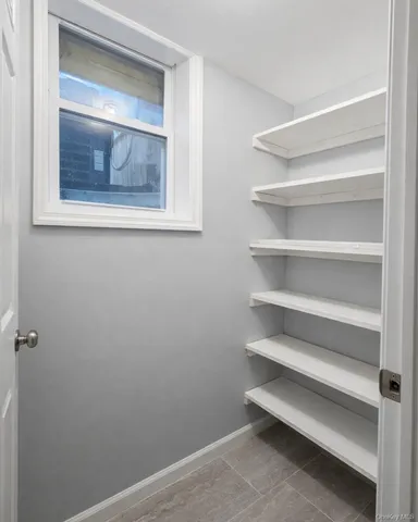 a view of room with closet and window