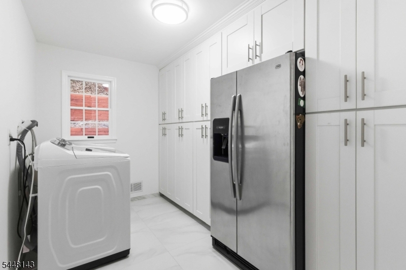 56 Union Hill Road Morris Plains, NJ 07950 - Photo 10 of 31 a utility room with dryer and washer