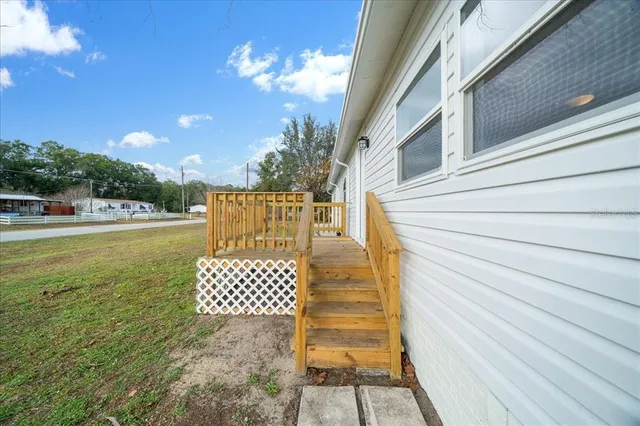a view of a balcony with wooden floor