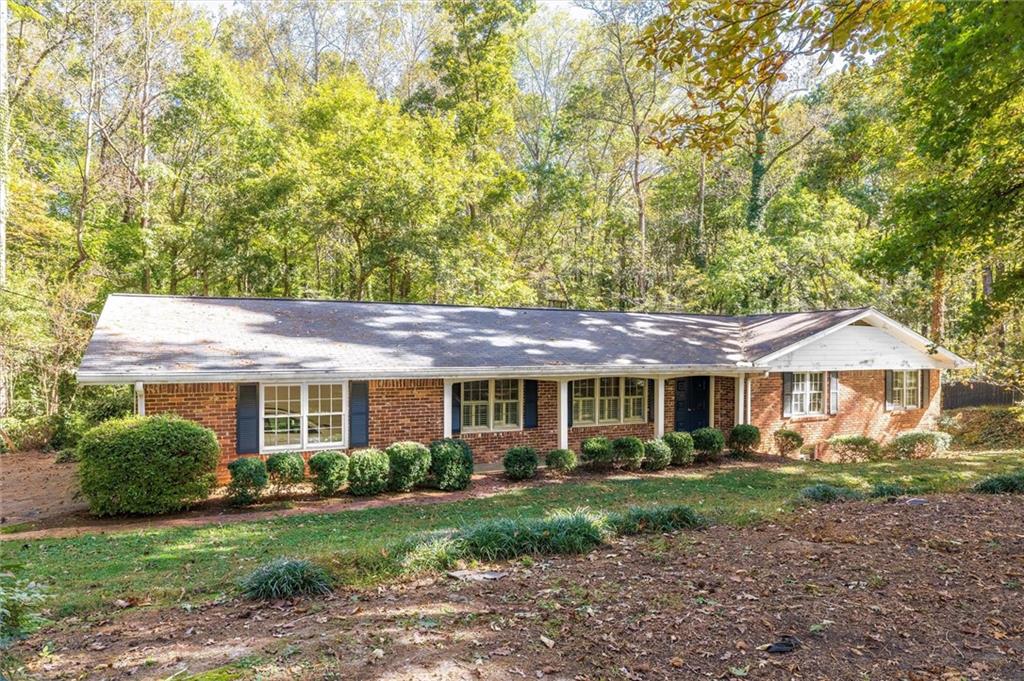 2350 Oxbow Circle Smoke Rise, GA 30087 - Photo 1 of 51 a front view of a house with a yard