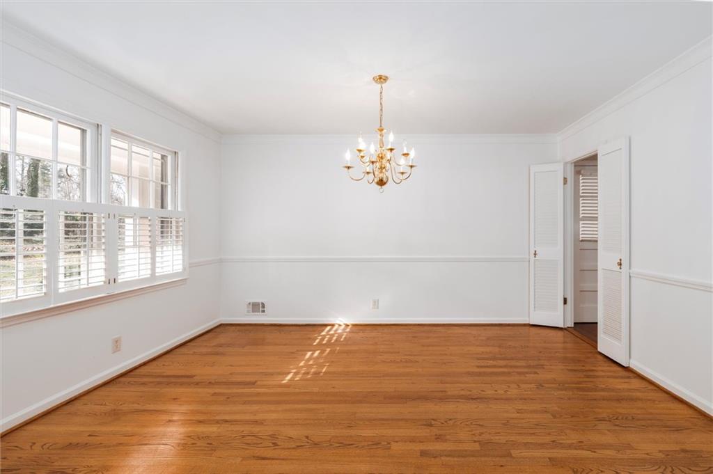 2350 Oxbow Circle Smoke Rise, GA 30087 - Photo 12 of 51 wooden floor in an empty room with a window
