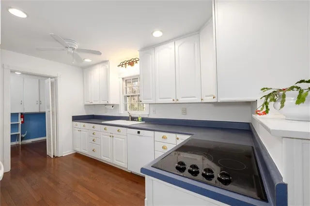 a bathroom with a sink a mirror and toilet