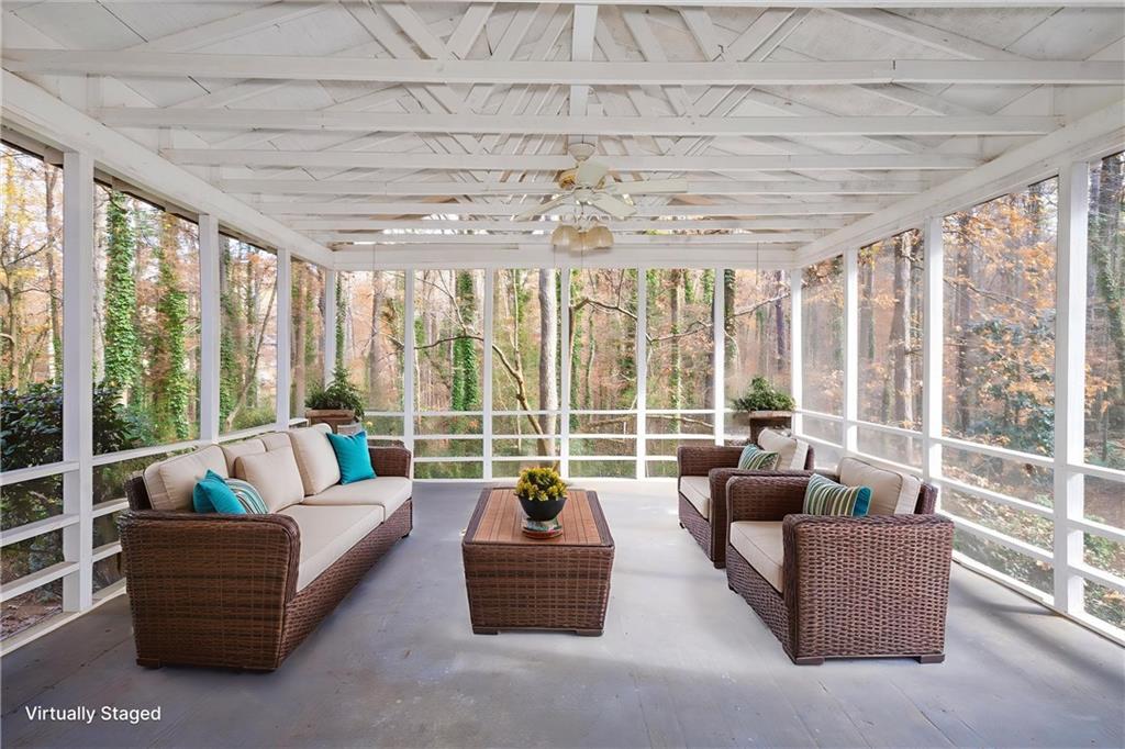 2350 Oxbow Circle Smoke Rise, GA 30087 - Photo 21 of 51 a living room with furniture and floor to ceiling windows