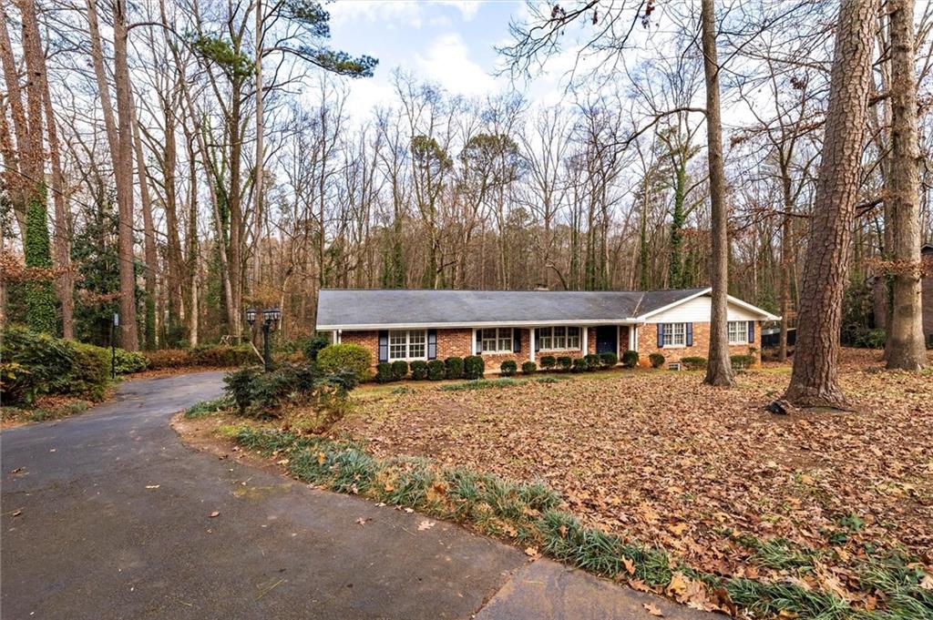 2350 Oxbow Circle Smoke Rise, GA 30087 - Photo 3 of 51 front view of a house with a yard