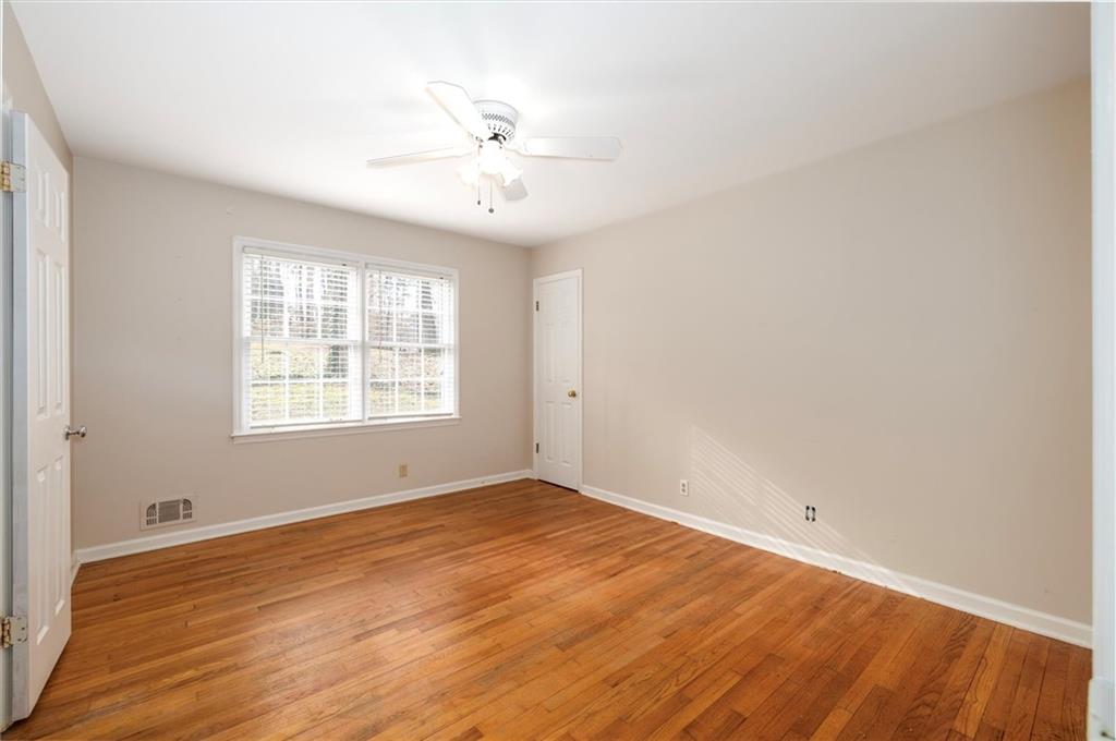 2350 Oxbow Circle Smoke Rise, GA 30087 - Photo 31 of 51 wooden floor in an empty room with a window