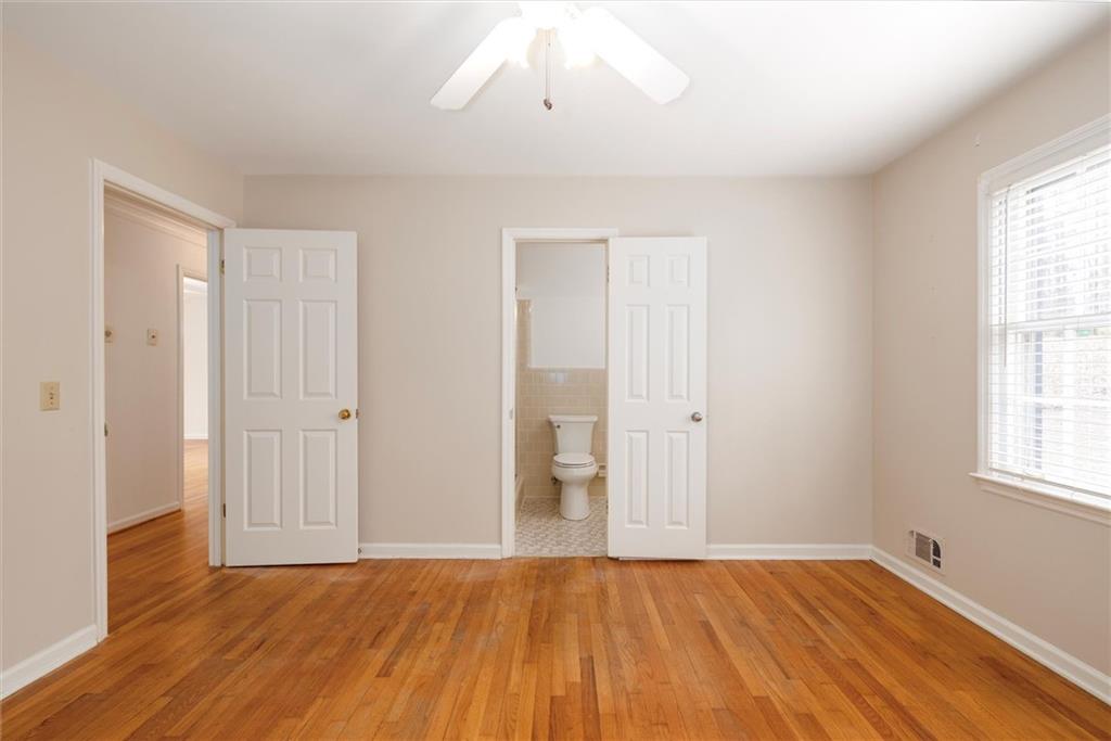 2350 Oxbow Circle Smoke Rise, GA 30087 - Photo 32 of 51 a view of an empty room with wooden floor and a window