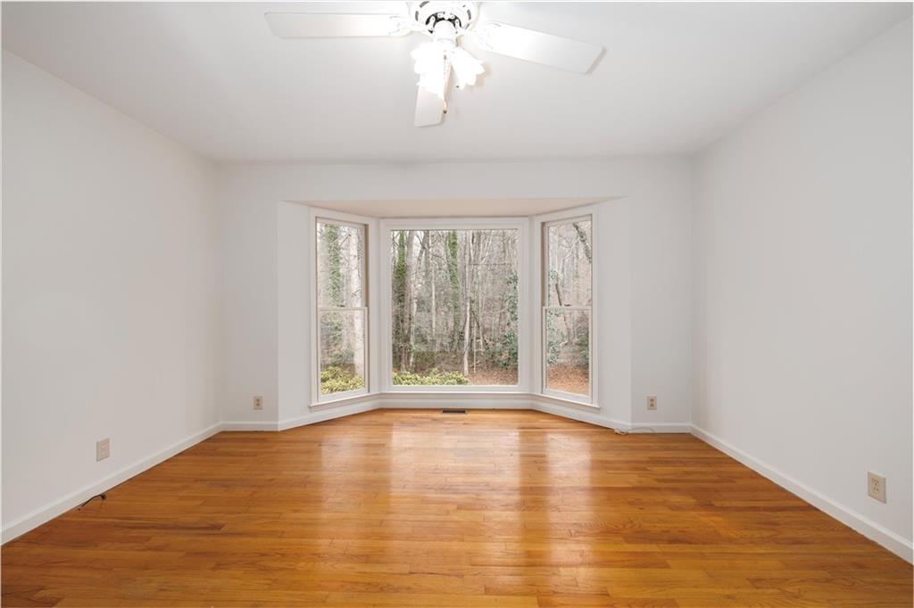 2350 Oxbow Circle Smoke Rise, GA 30087 - Photo 34 of 51 a view of an empty room with wooden floor and a window
