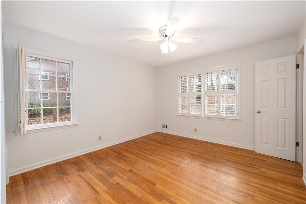 2350 Oxbow Circle Smoke Rise, GA 30087 - Photo 36 of 51 a view of an empty room with wooden floor and a window