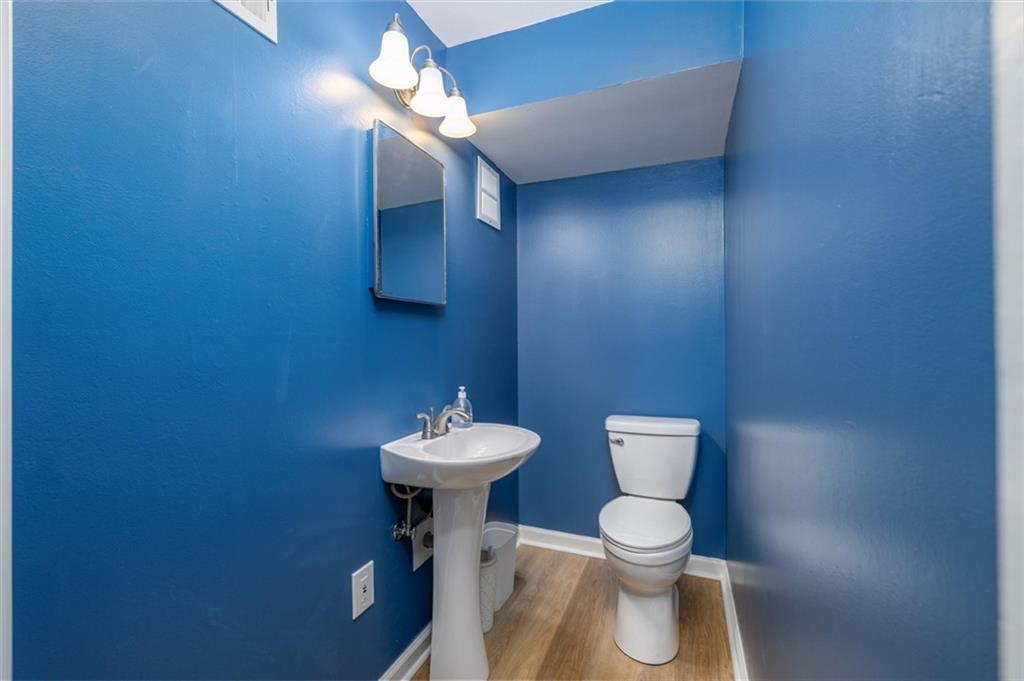 2350 Oxbow Circle Smoke Rise, GA 30087 - Photo 41 of 51 a bathroom with a toilet a sink and mirror