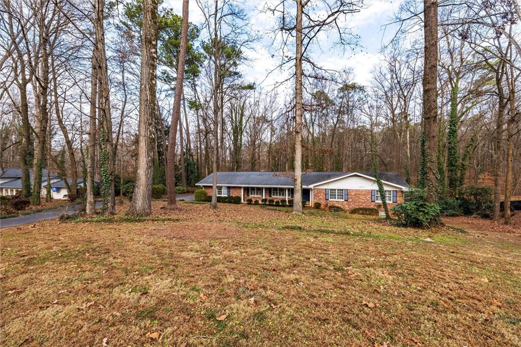 2350 Oxbow Circle Smoke Rise, GA 30087 - Photo 48 of 51 a view of a house with a yard and sitting area