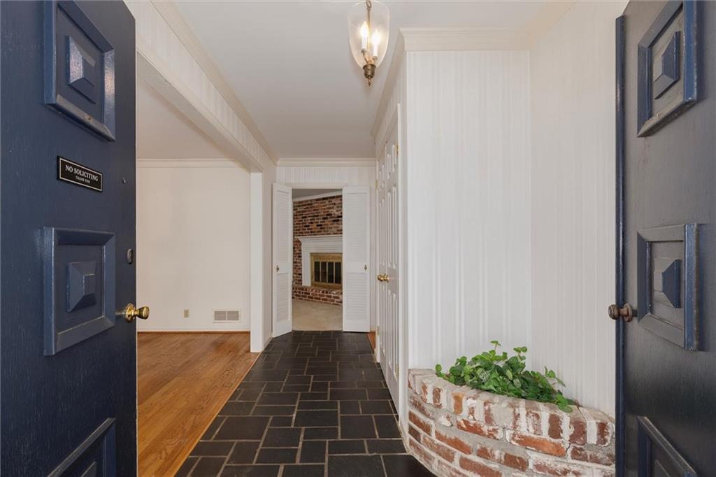 2350 Oxbow Circle Smoke Rise, GA 30087 - Photo 7 of 51 a view of a hallway with wooden floor and a bathroom