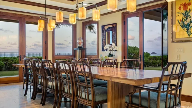 a view of a dining room with furniture and a potted plant