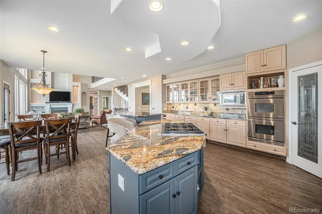 a view of a dining room with furniture and a chandelier