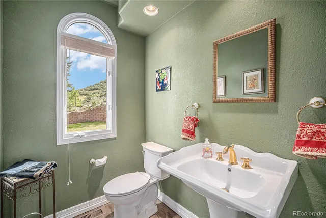 a bedroom with a bed and a fireplace