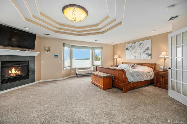 a living room with furniture kitchen view and a window