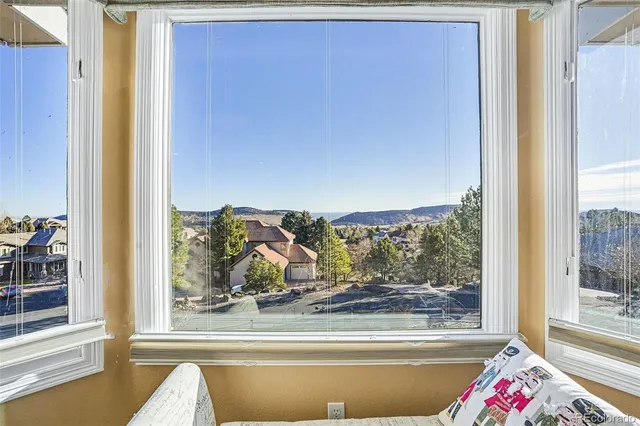 a view of a dining area with furniture window and outside view