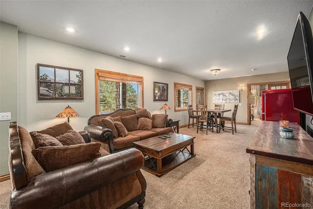 a dinning table sitting next to a tall building