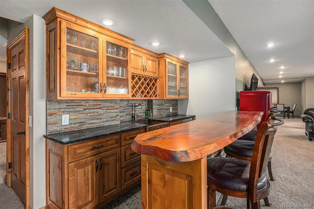 a bed sitting in a room next to a window