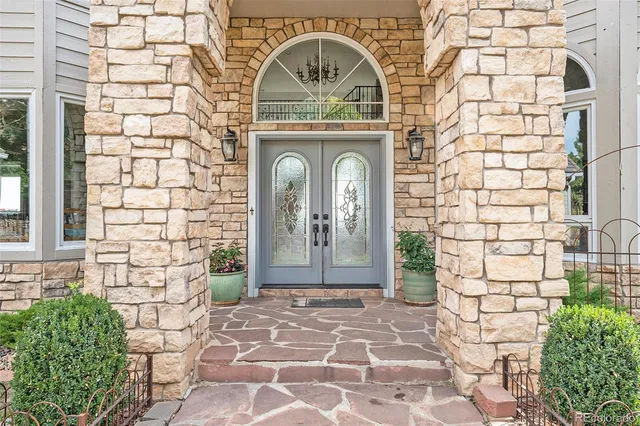 a view of a wooden door with a bench