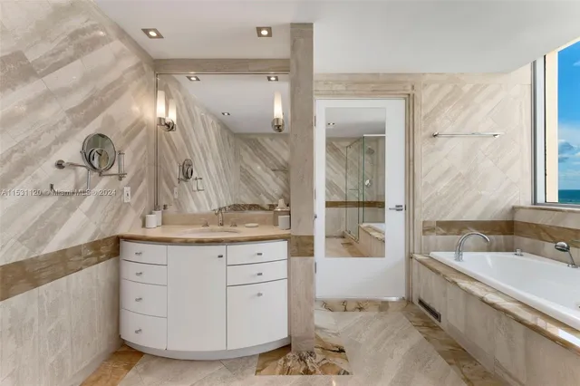 a bedroom with a large bed and a large window