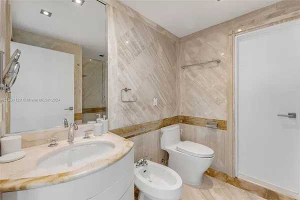 a bathroom with a sink and mirror