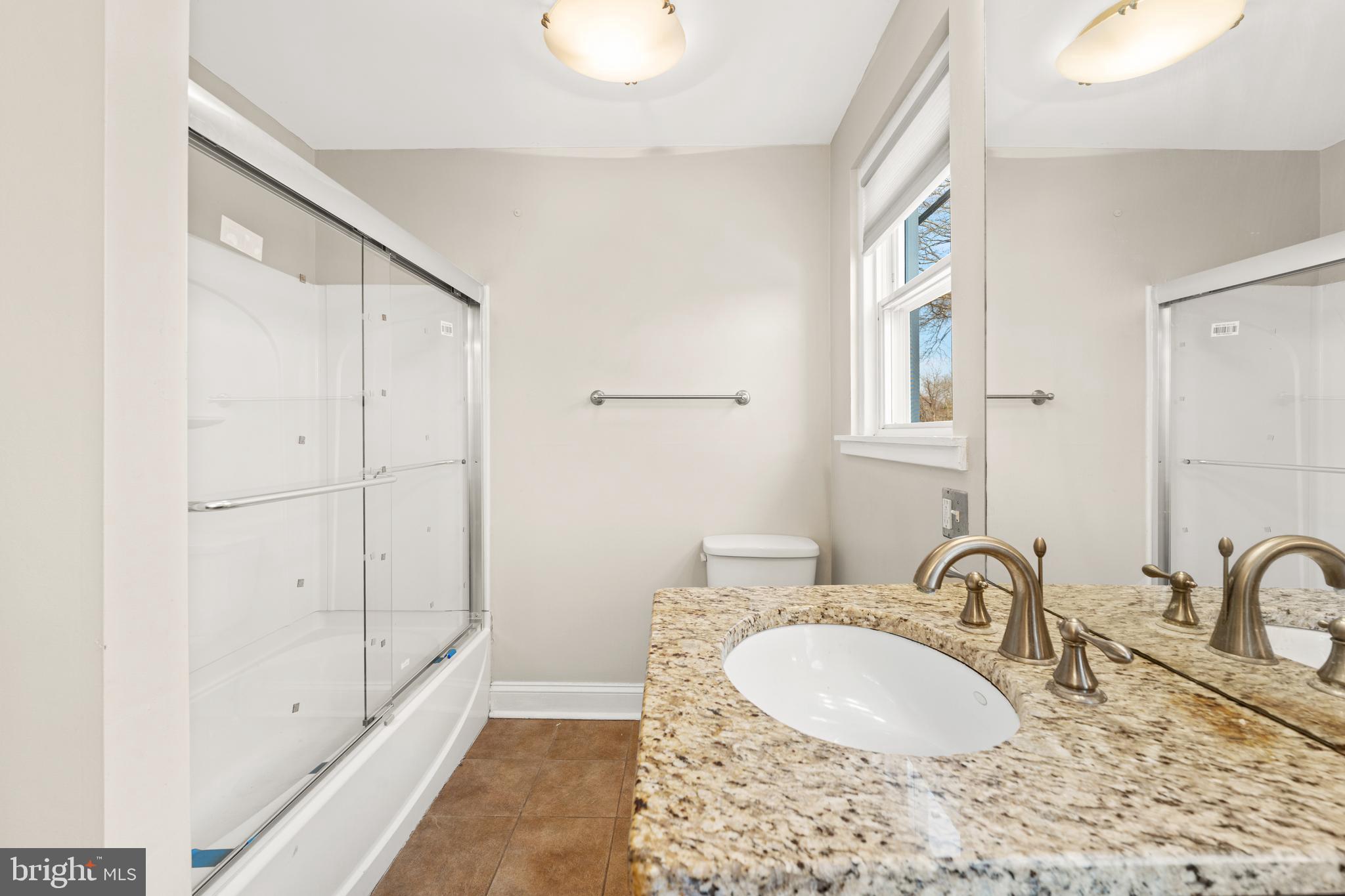 1441 Lawrence Road Havertown, PA 19083 - Photo 11 of 13 a bathroom with a sink and a mirror