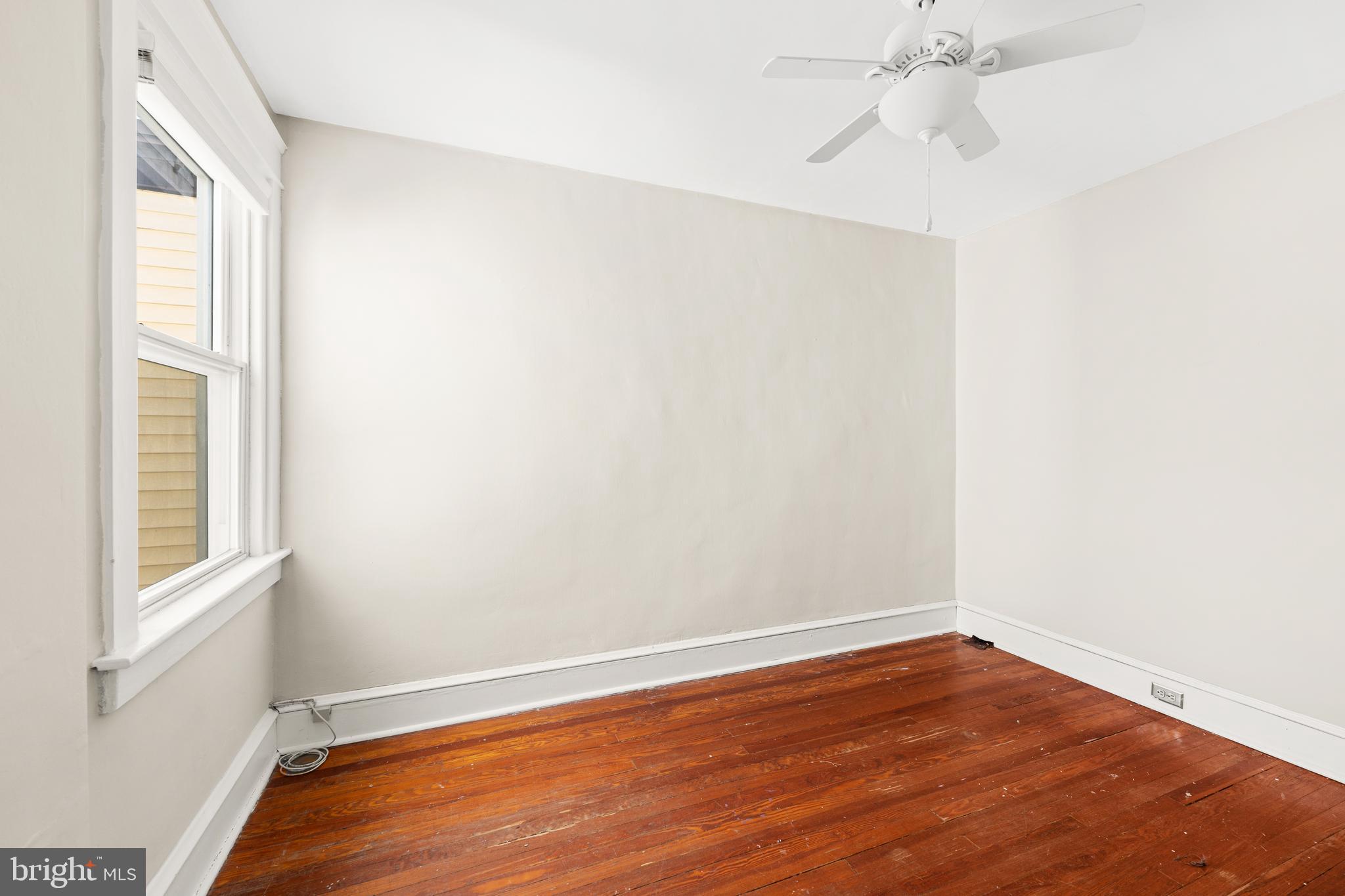 1441 Lawrence Road Havertown, PA 19083 - Photo 10 of 13 an empty room with wooden floor and windows