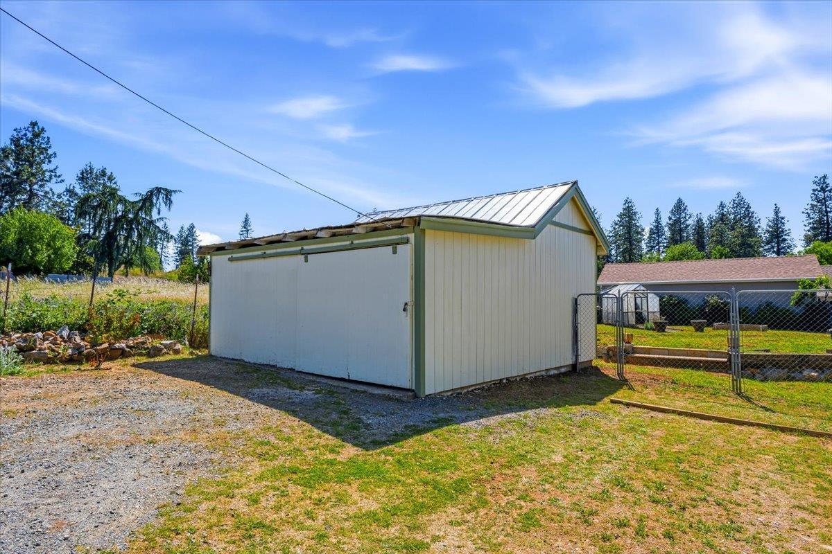 232 Upper Slate Creek Road Grass Valley, CA 95945 - Photo 39 of 48 a view of a house with backyard and sitting area