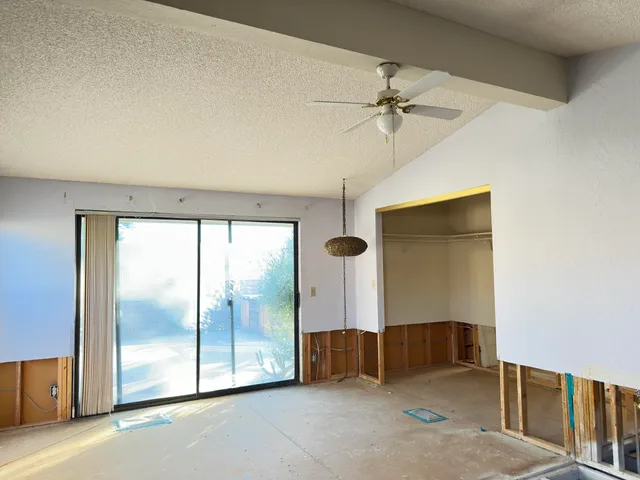 a bedroom with furniture and window