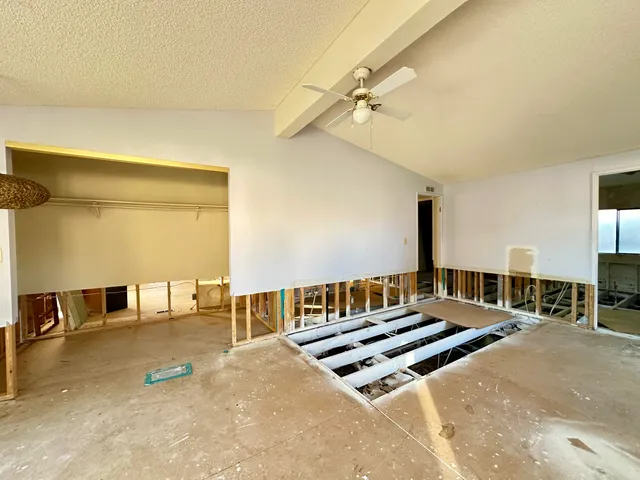 a view of a room with wooden walls