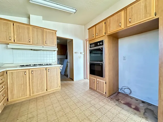 a view of a refrigerator and window